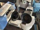 two microscopes that are sitting next to each other