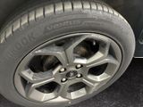 a close up of a tire on a car ' s rim