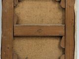 an old picture frame with a hole in the middle of it