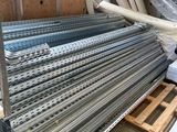 many different types of steel bars stacked on a pallet