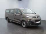 the brown van is parked in a white room with a black floor