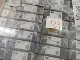 a lot of packages on a pallet in a warehouse