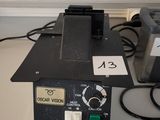 a machine that is sitting on a table next to some wires