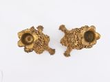 pair of antique brass candlesticks on a white background