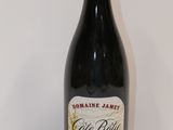 a bottle of wine that is sitting on a table
