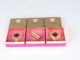 three pink boxes with gold hearts and a pink box with a gold heart