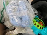 a cardboard box filled with toys and other items