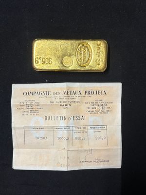 a picture of a piece of paper with a gold bar on it