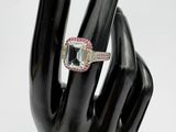 an image of a woman ' s hand with a ring on it