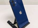 the back of a blue iphone with a black stand on it