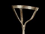 an image of a close up of a metal object on a black background