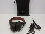 a pair of headphones sitting on a table next to a bag