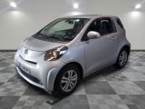 a picture of a small silver car on a checkered floor