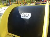 a black and yellow mailbox with a white number on it