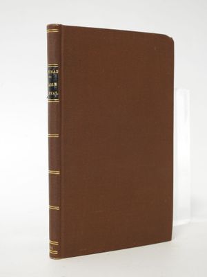 a brown book sitting on top of a white table