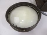 a bowl of milk sitting on a table next to a lamp