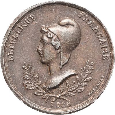 an old coin with a bust of a man wearing a helmet