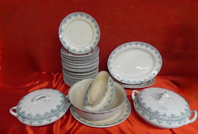 a lot of plates and bowls on the table