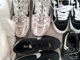 several pairs of shoes are lined up on a white surface