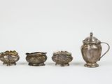 four pieces of silverware including a teapot, sugar and creamer