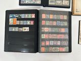 a lot of different stamps on the pages of a book
