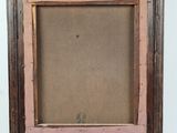 an old picture frame with a brown background and a pink border