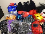a pile of assorted toys and costumes on a table