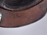 a close up of a leather hat with a metal buckle