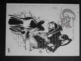 Batman et Catwoman dessinés à l'encre noire et blanche sur une feuille de papier