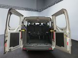 a white van with its doors open in a room