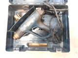 a tool in a case that is sitting on the floor