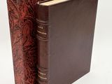 a brown book with a brown cover and a red cover
