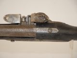 an old gun that is on display in a museum