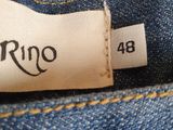 the back of a pair of blue jeans with a tag on it