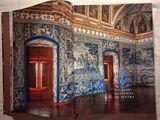 a book with a picture of a room with blue and white walls