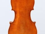 an old violin with a wooden back and bow on a white background