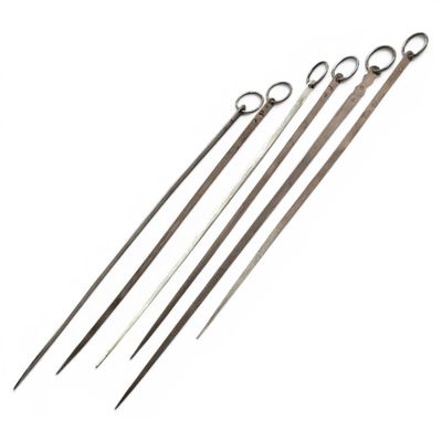 a set of four stainless steel knitting needles on a white background