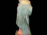 an image of a statue of a woman in a blue dress