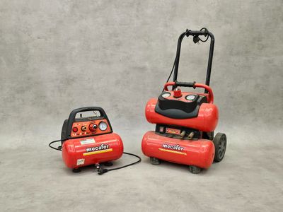 a couple of air compressors sitting on top of each other