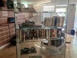 a glass case with a lot of books in it