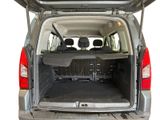 the back of a silver van with its trunk open showing the cargo area