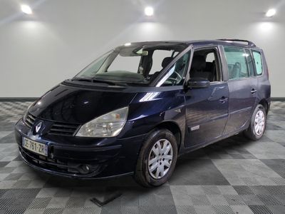 a picture of a small blue van parked in a garage