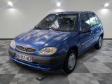 a picture of a blue car parked in a garage