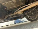 a close up of a car ' s exhaust pipe and exhaust pipe