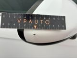 a close up of a car ' s side mirror with a measuring tape on it