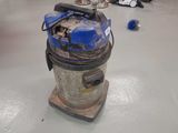 a vacuum that is sitting on the floor in the room