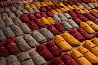 many pairs of shoes that are lined up on the floor