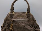 a brown handbag with a gold lock on the handle