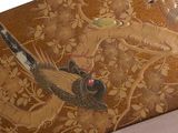 an image of a decorative box with birds and flowers on it