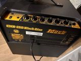 an electric guitar amplifier sitting on top of a wooden floor